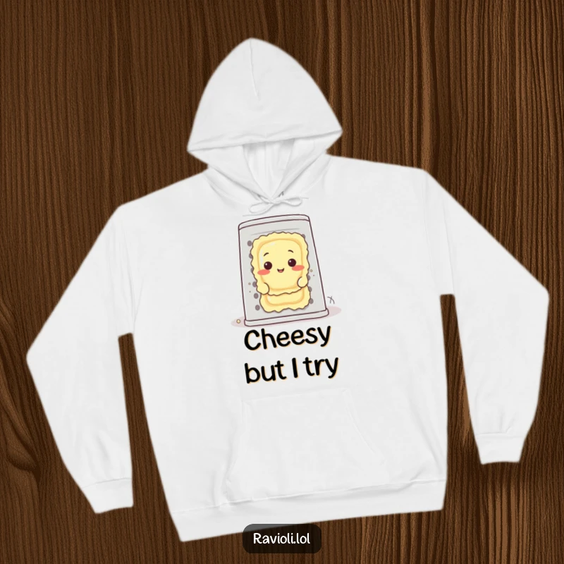 Funny ravioli character peeks from behind a huge cheese grater, showcasing a cartoonish food-themed humorous design on a hoodie.